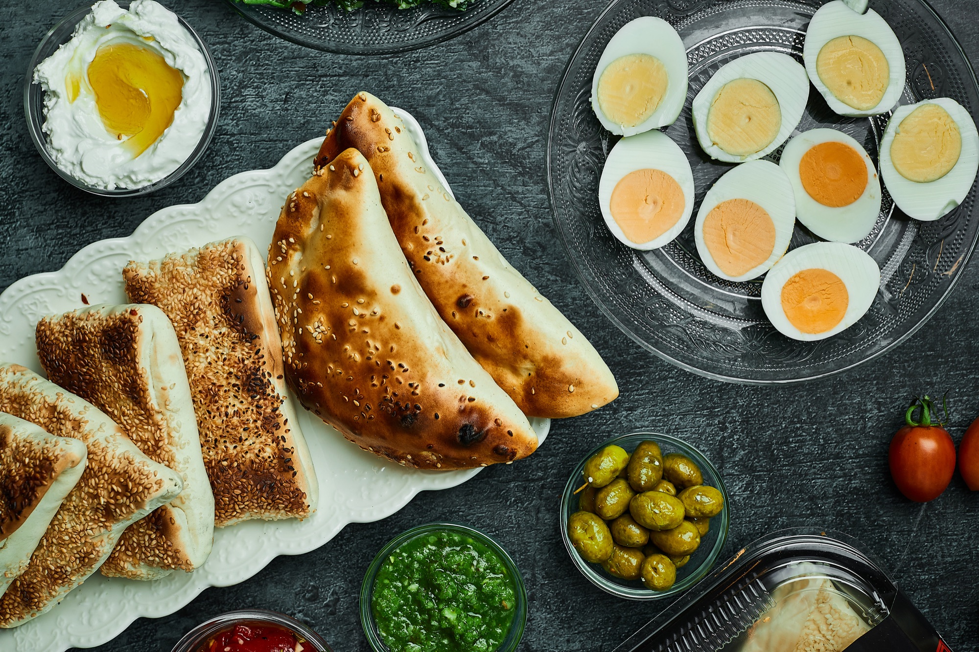 A table laid with TABUNA breads, salads and pastries